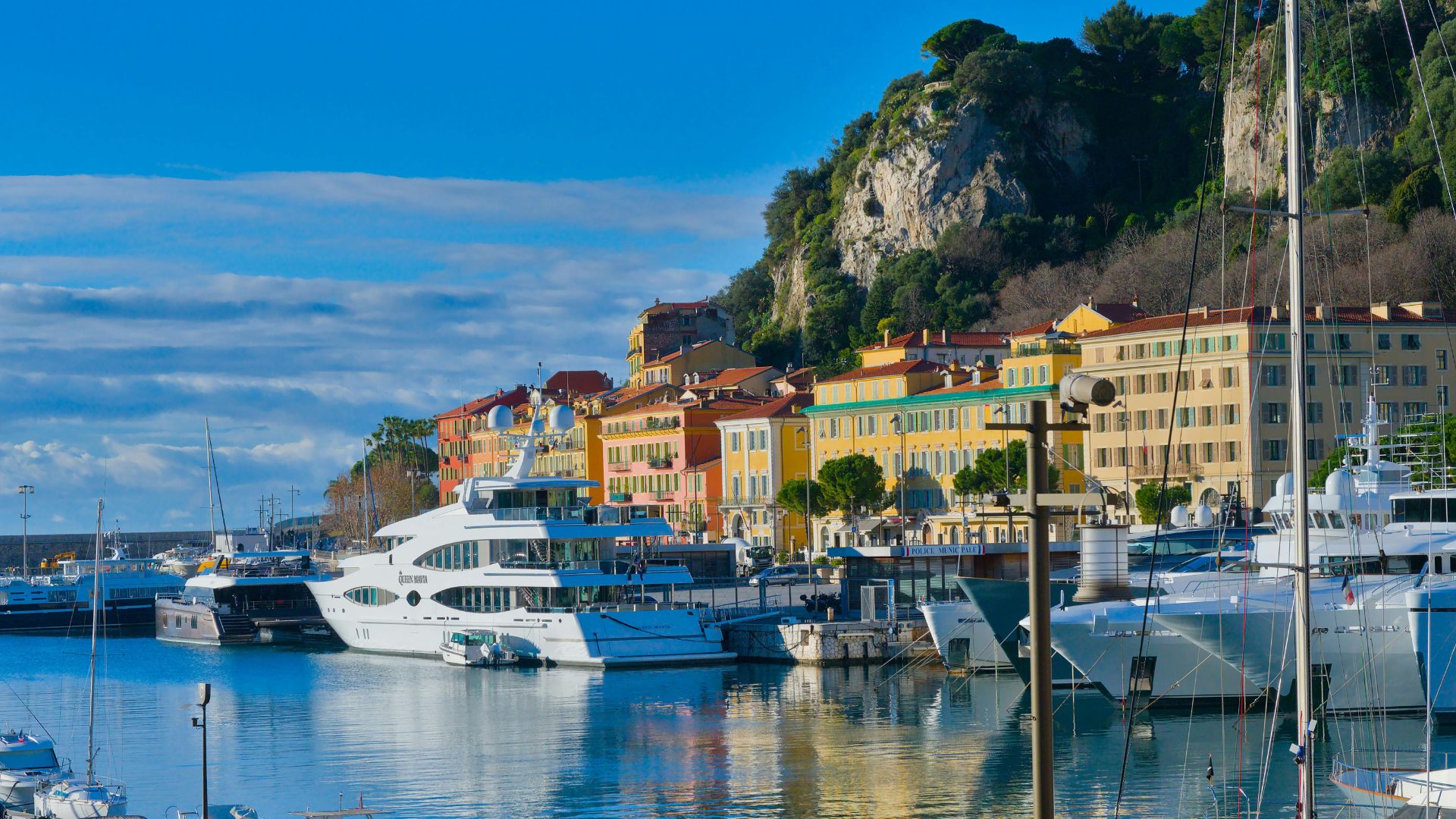 Superyachts moored in a Mediterranean harbour